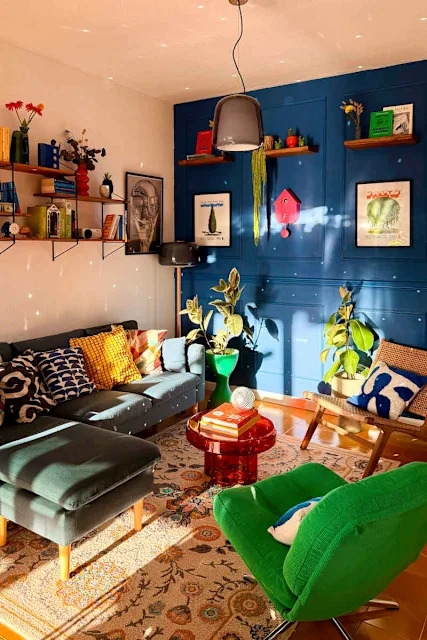 Blue Paneled Accent Wall Ideas with Translucent Red Coffee Table