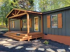 Board and Batten Manufactured Home with Gabled Wood Porch