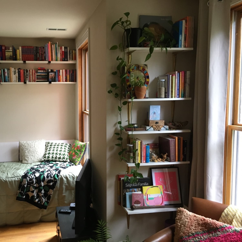 Boho Chic Daybed Nook with floor-to-ceiling shelving.