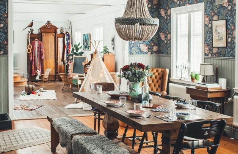 Boho Chic Dining Room with floral wallpaper and beaded chandelier.
