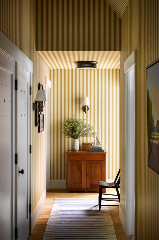 Bold Striped Wallpaper Hallway with Wooden Chest and Ceiling Stripes