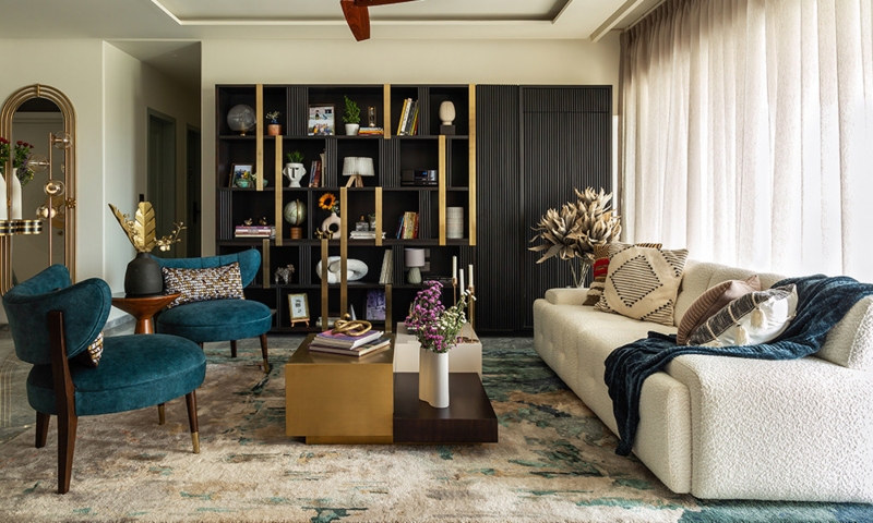 Boucle Sofa Styling: Teal Velvet Chairs & Black and Gold Bookcase