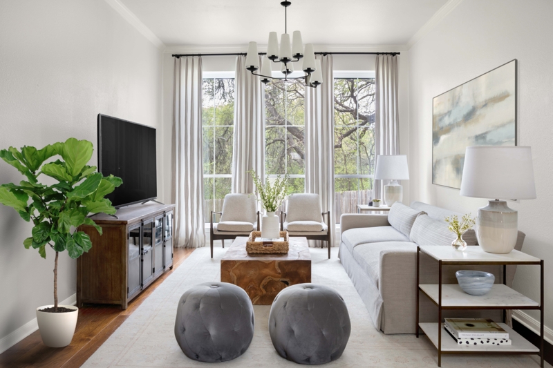 Bright Living Room: Tall Windows and Rustic Wood Table