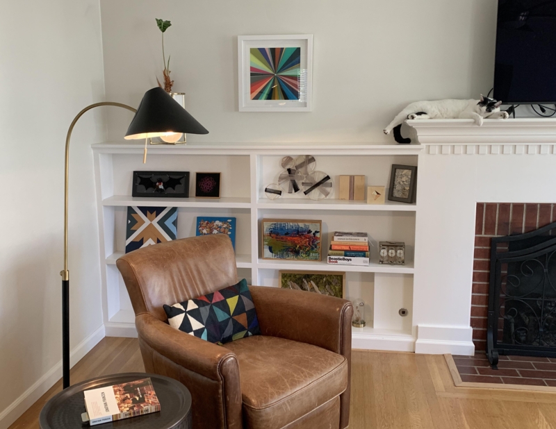 Brown Leather-look Accent Chair with Mid-Century Modern Arc Lamp.