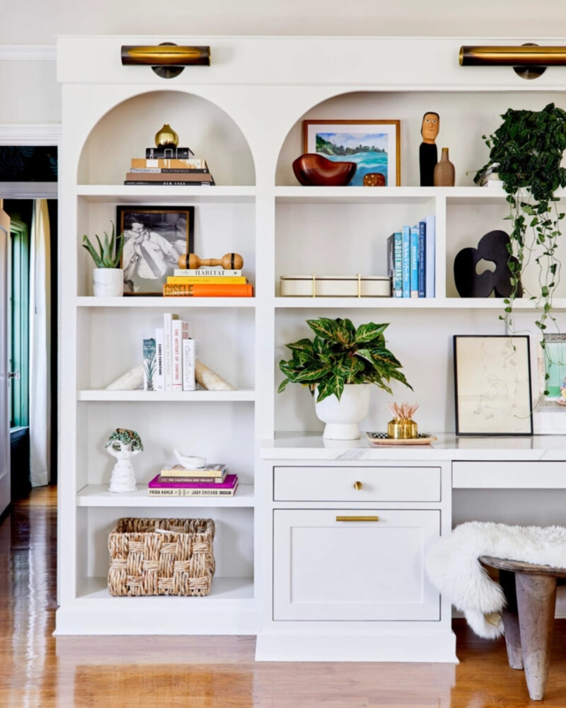 Built-in Bookcase: Custom Unit featuring Arched Alcoves and Desk.