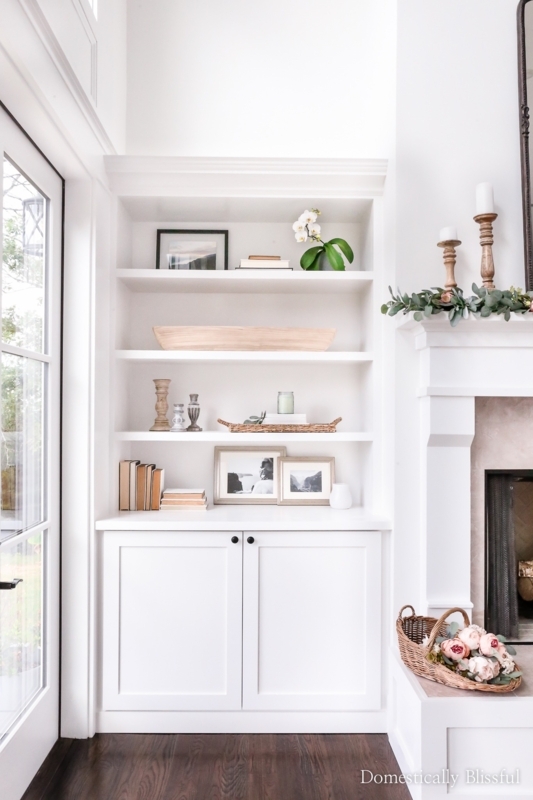 Built-in Bookcase: Integrated Wall Unit with Transitional Airy Styling.