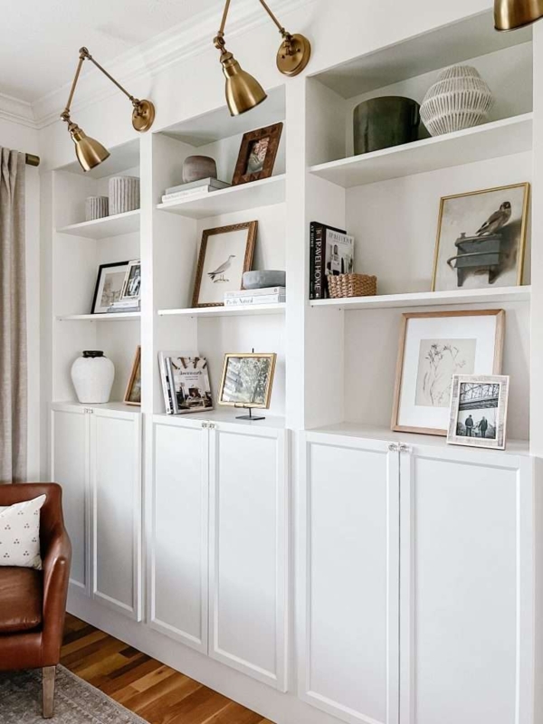 Built-in Bookcase: Modern Farmhouse Style with Brass Library Sconces.