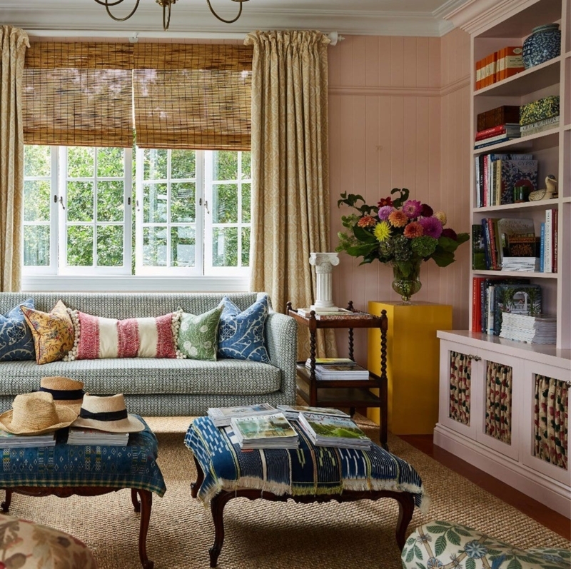Built-in Bookcase: Soft Pink Beadboard Walls with Ikat Ottomans