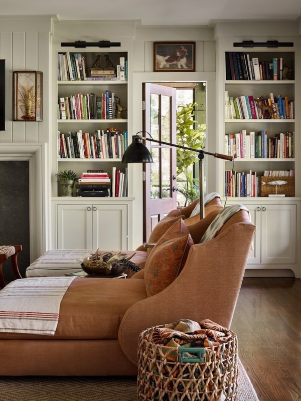 Built-in Bookcase: Symmetrical Layout framing a Glass Paneled Door.