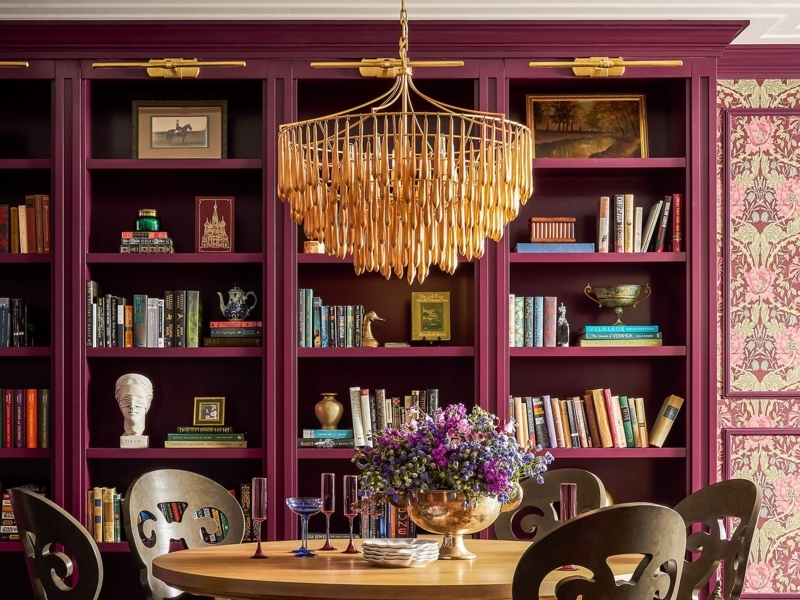 Built-in Bookshelf: Deep Burgundy with Tiered Gold Light Fixture