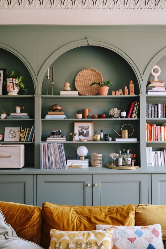 Built-in Bookshelf: Sage Green with Arched Alcoves and Vinyl Storage