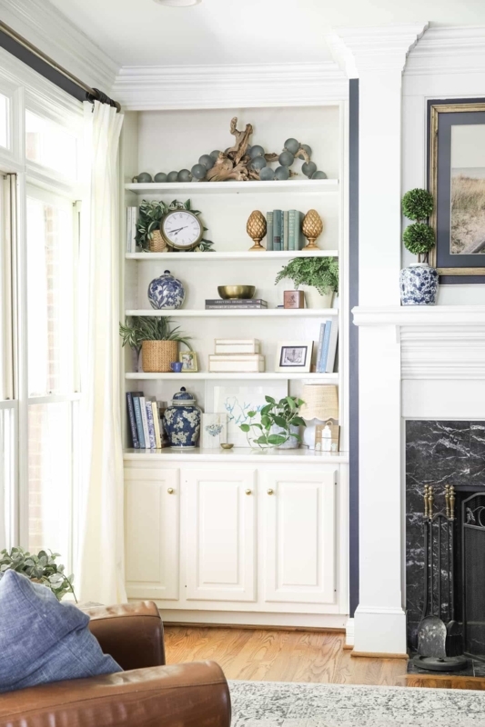 Built-in Bookshelf styled with Blue and White Ginger Jars and Decor.