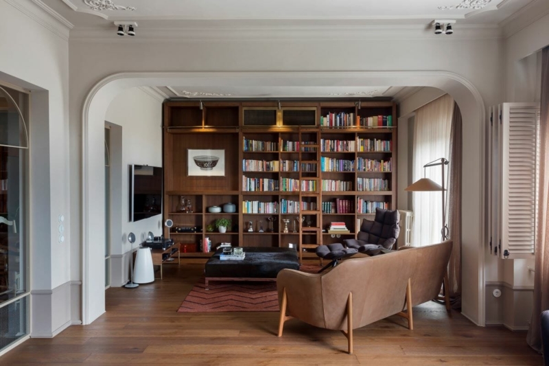 Built-in Bookshelf: Warm Wood Library Wall with Integrated Ladder.