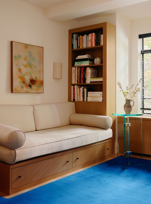 Built-In Daybed with Storage drawers and vibrant blue rug.