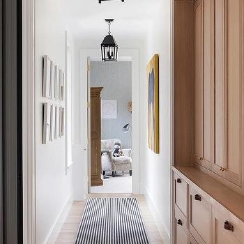 Built-In Hallway Cabinetry with Striped Runner & Lantern Pendant