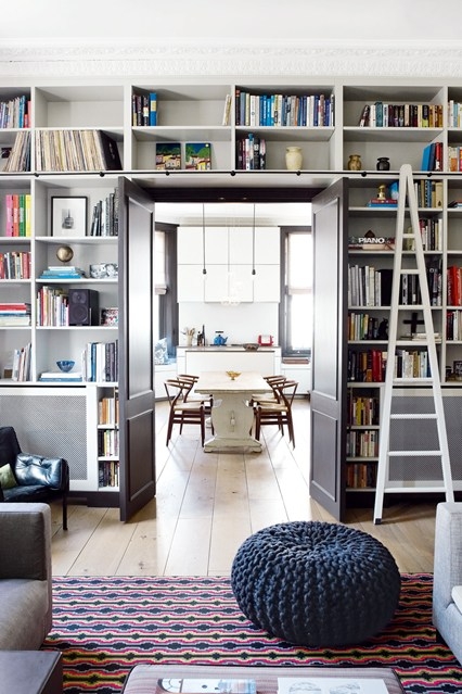 Built-In Library Shelving with Ladder & Pocket Doors in Hallway