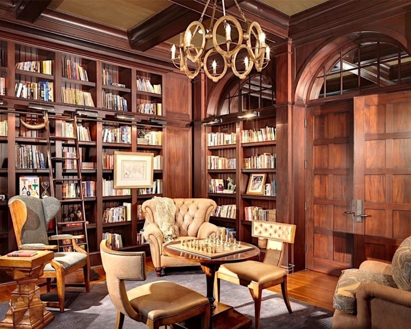 Classic Home Library: Traditional Walnut Paneling and Hoop Chandelier
