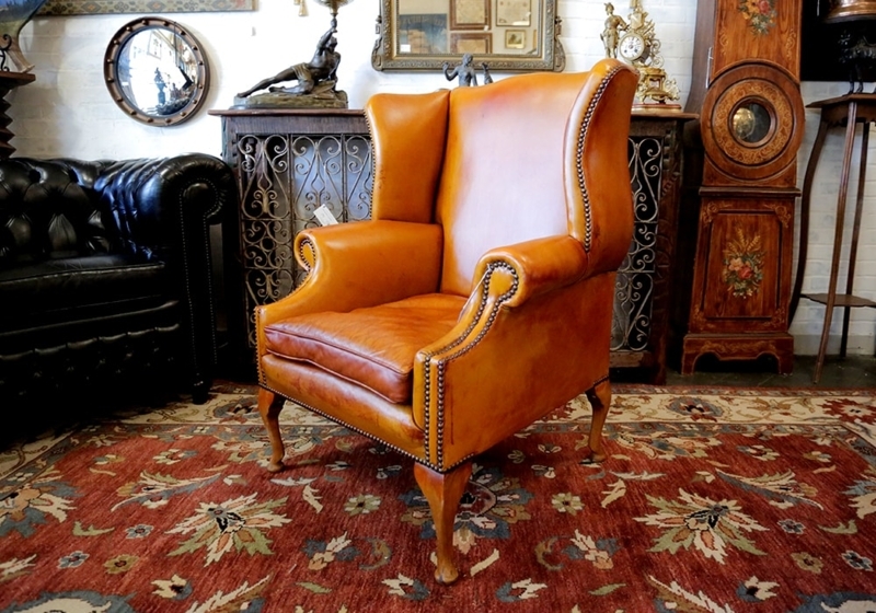 Classic Tan Leather Wingback Chair with Brass Nailhead Trim Details