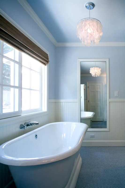 Coastal Bathroom with Shell Chandelier, Beadboard and Blue Penny Tile Floor