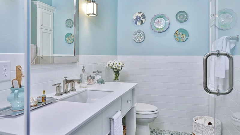Coastal Cottage Bathroom with Subway Tile Wainscoting and Pebble Mosaic Floor