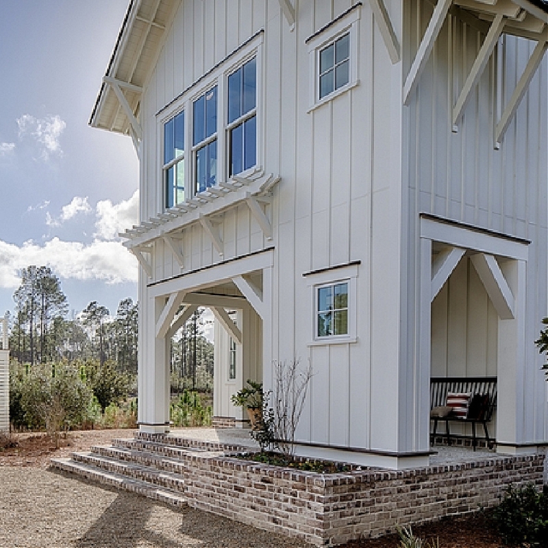 Coastal Cottage Exterior With Brick Porch And Rafters