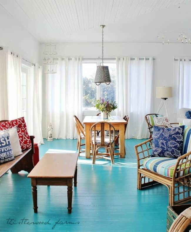 Coastal Dining Room featuring Turquoise Floor and Plank Ceiling