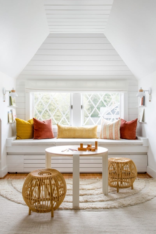 Coastal Farmhouse Attic Reading Nook with Rattan Barrel Stools