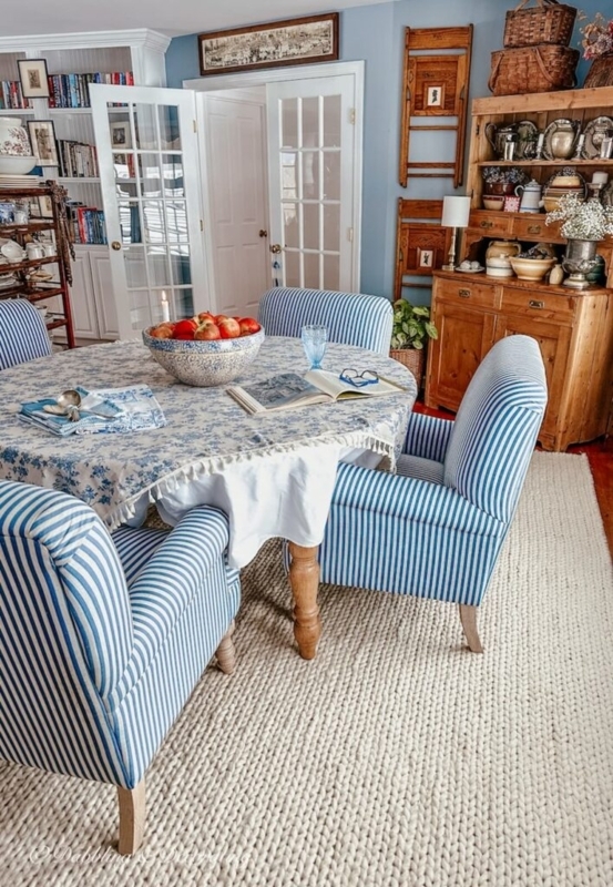 Coastal Farmhouse Dining Room with Blue Striped Chairs and Chunky Knit Rug