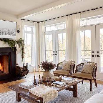 Coastal Farmhouse Living Room with Cane Chairs and Salvaged Wood Table
