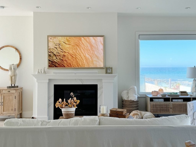 Coastal Living Room featuring Frame TV Mantel and Ocean Views