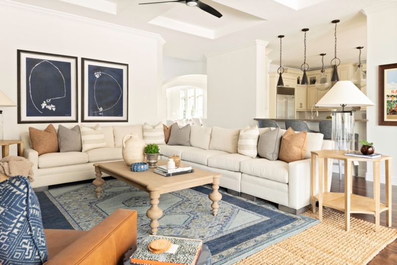 Coastal Living Room Layered Rugs & Large Cream Sectional Layout