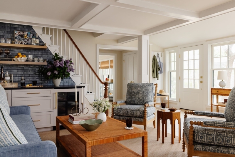 Coastal Living Room with Blue Spool Leg Accent Chairs and Wet Bar