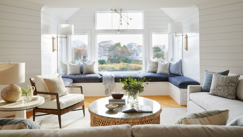 Coastal Living Room with Built-In Window Seat and White Shiplap Walls