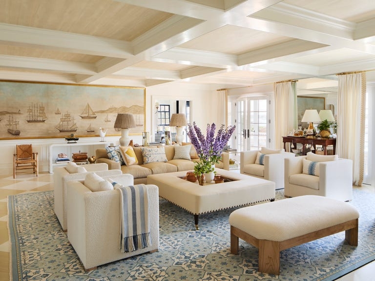 Coastal Living Room with Nautical Mural and Oversized Square Ottoman