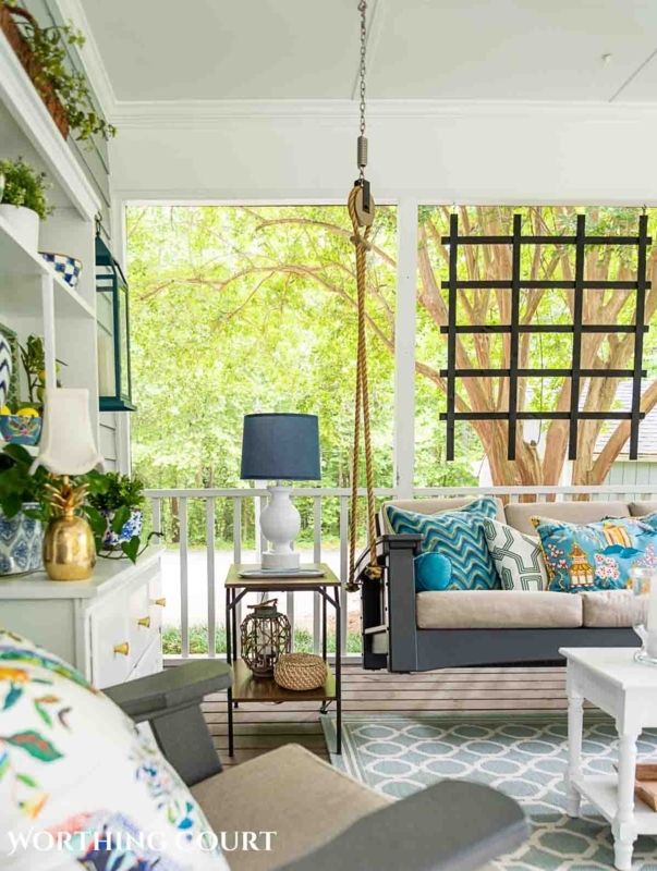 Coastal Porch with Hanging Swing, Blue and Green Decor & White Chest.
