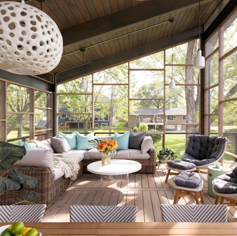 Coastal Porch with Vaulted Wood Ceiling & Tufted Lounge Chair Styling.