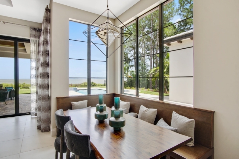 Contemporary Dining Nook with Floor to Ceiling Windows and View
