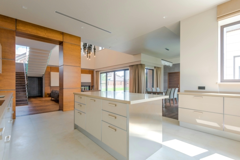 Contemporary Open Concept Kitchen with Wood Paneling & Large Island