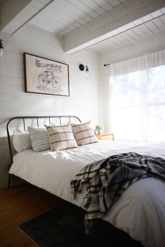 Cottage Bedroom Layout: Vaulted Beams & White Shiplap Paneling