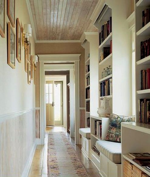 Cottage Hallway Library with Wood Plank Ceiling and Reading Nooks