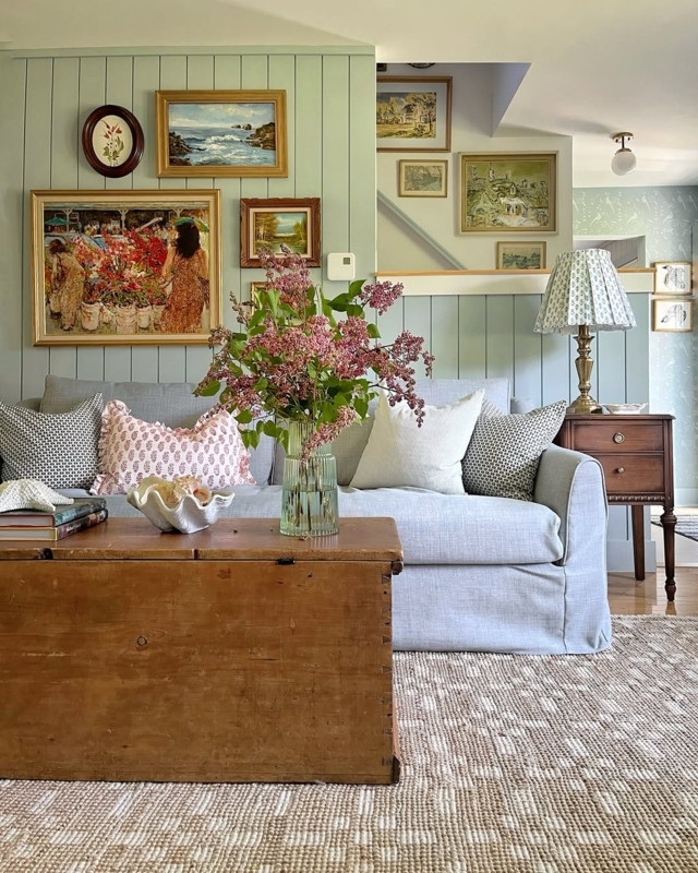 Cottage Living Room with Sage Green Paneling and Trunk Table
