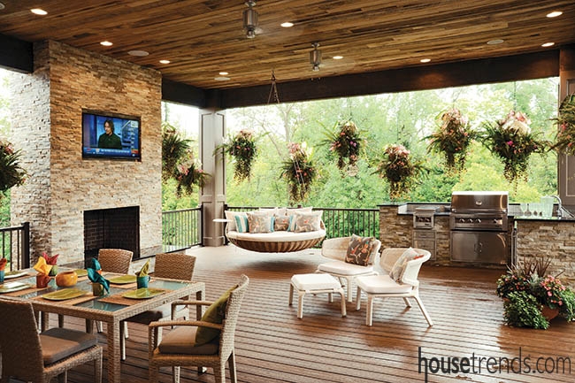 Covered Porch with Rustic Wood Planked Ceiling and Stone Fireplace