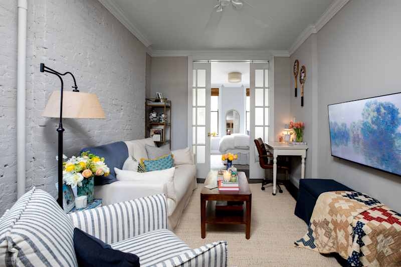 Cozy Transitional Living Room with White Painted Brick Wall