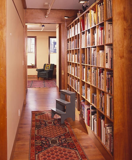 Craftsman Hallway Library featuring Warm Wood Tone Grid Shelving