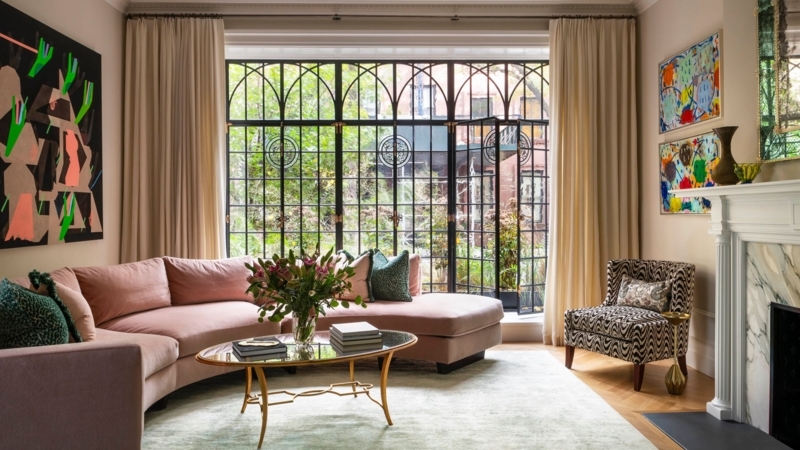 Curved Blush Sectional in Eclectic Living Room with Arched Windows