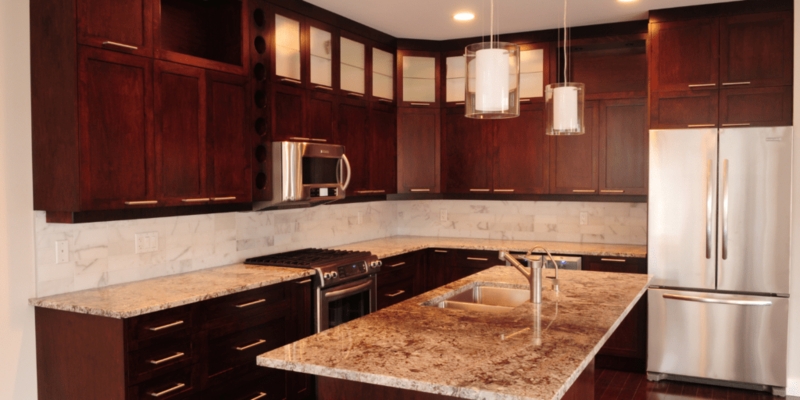 Dark Cherry Kitchen Cabinet Design with Glass Front Uppers and Wine Rack
