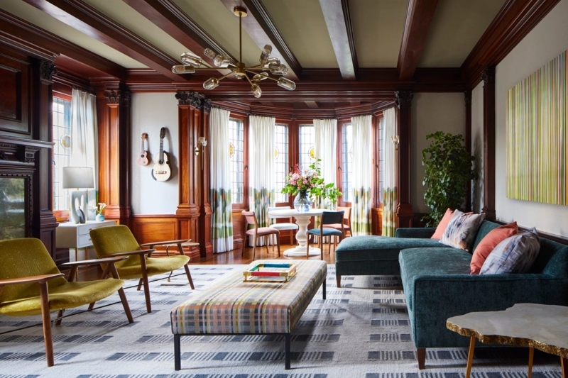 Dark Wood Paneling in Traditional Living Room with Teal Sectional Sofa