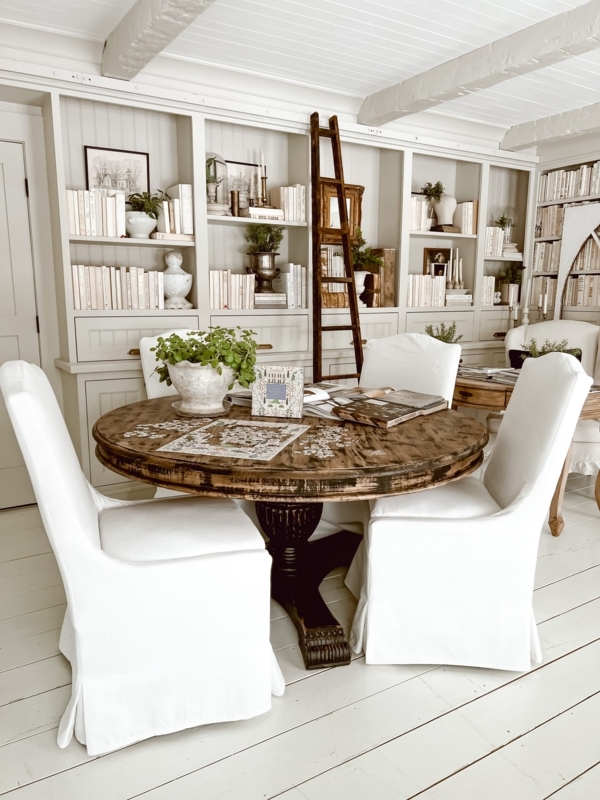 Dining Table with Distressed Tabletop in All-White Library Setting