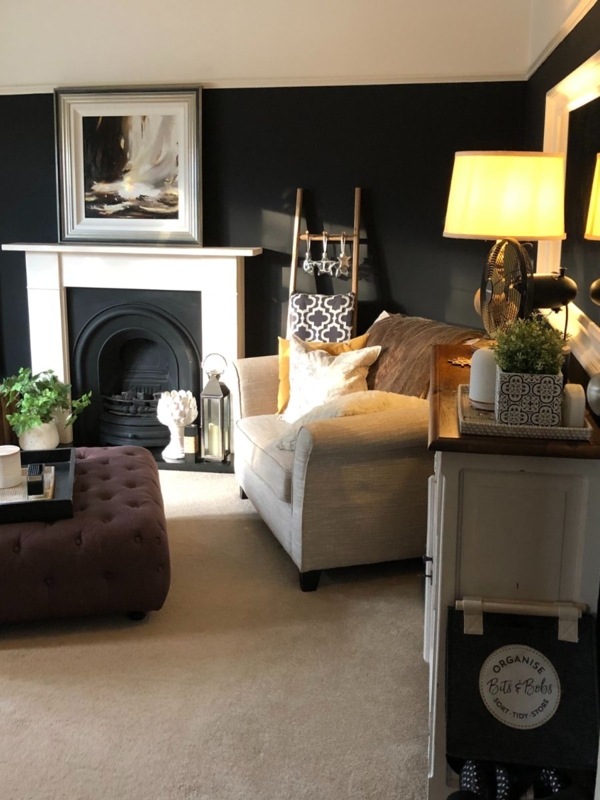 Dramatic Living Room: Black Accent Wall & White Mantel Contrast