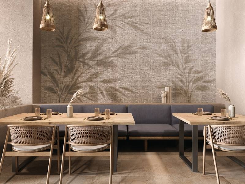 Earthy Modern Dining Room with Botanical Shadow Mural and Cane Chairs